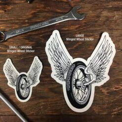 Winged Wheel Sticker - Small 7 Winged Wheel Sticker - Small -Motor Parts Hub winged wheel stickers comparision 1